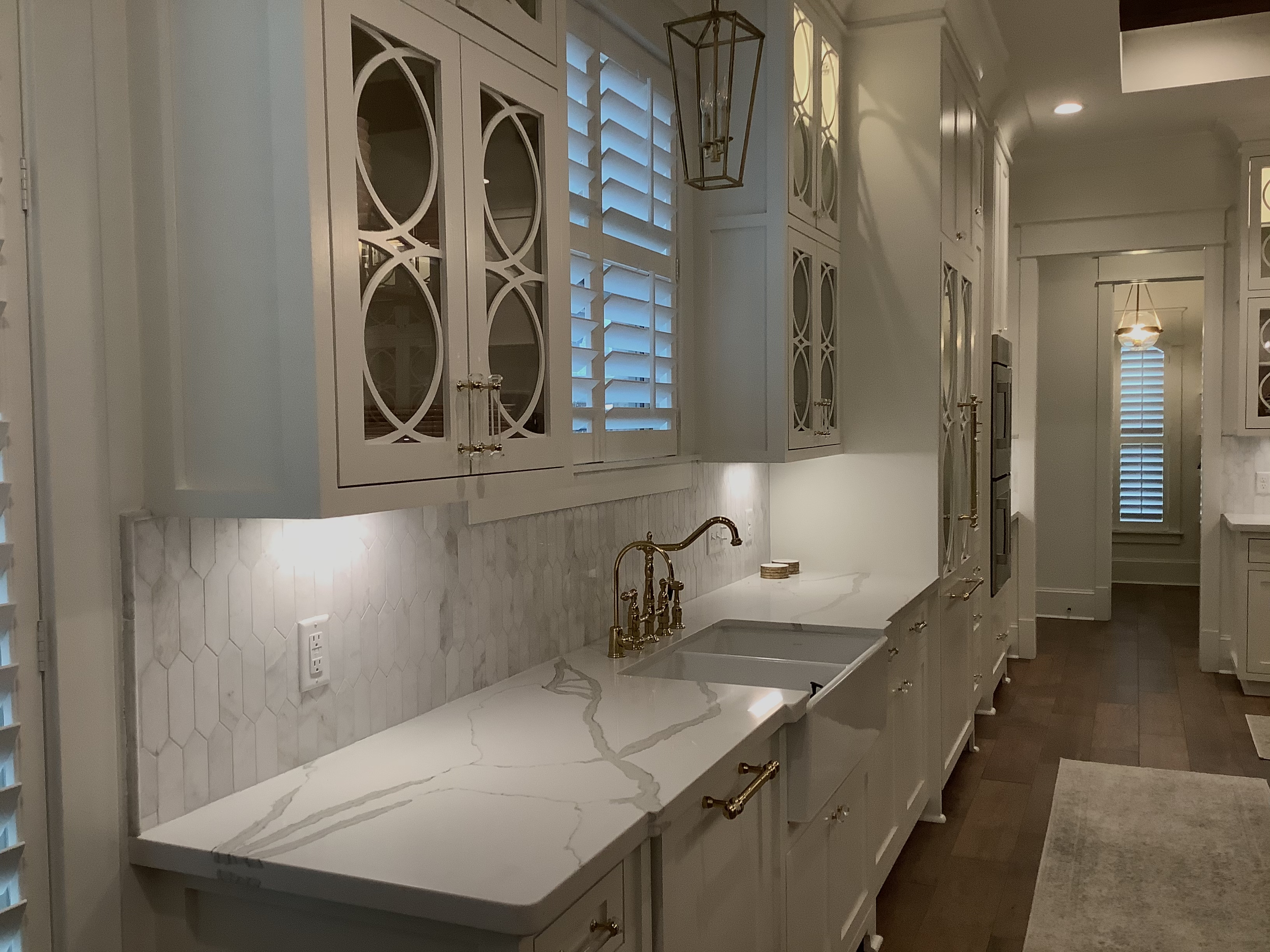 Elegant kitchen with brass fixtures and marble countertops